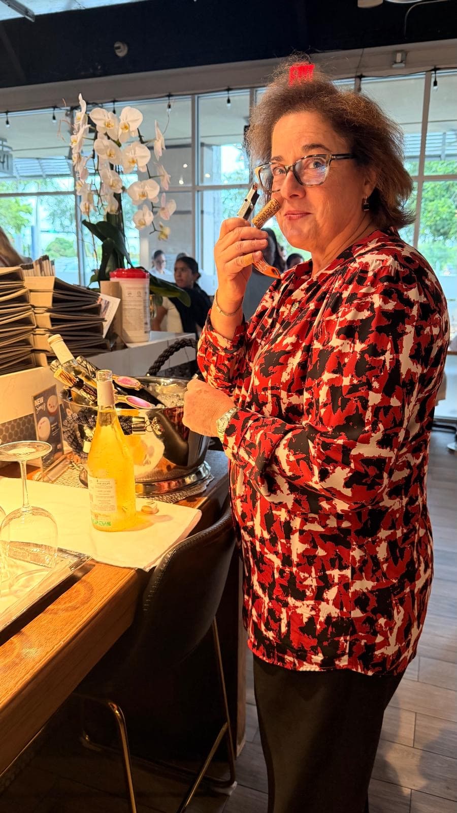 A guest examining a cork during a tasting