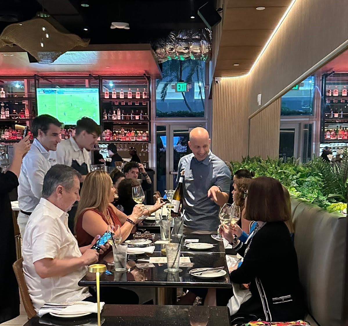 An instructor serving a table